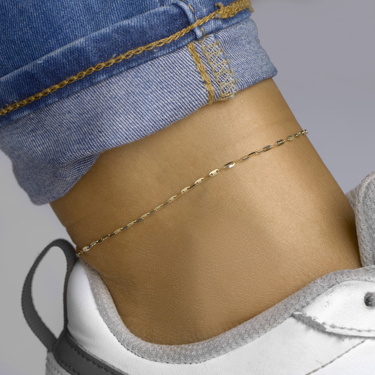 Enkelbandje plaatjes 1,5 mm 24 - 26 cm 14K geelgoud