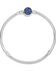Snake chain sterling silver bracelet with disc clasp with stellar blue crystal 599288C01, exclusief en kwalitatief hoogwaardig. Ontdek nu!