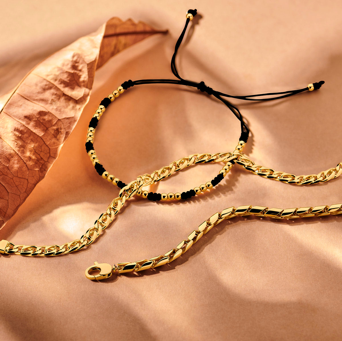 Armband bolletjes 13 - 26 cm 14K goud met rubber/nylon/leer