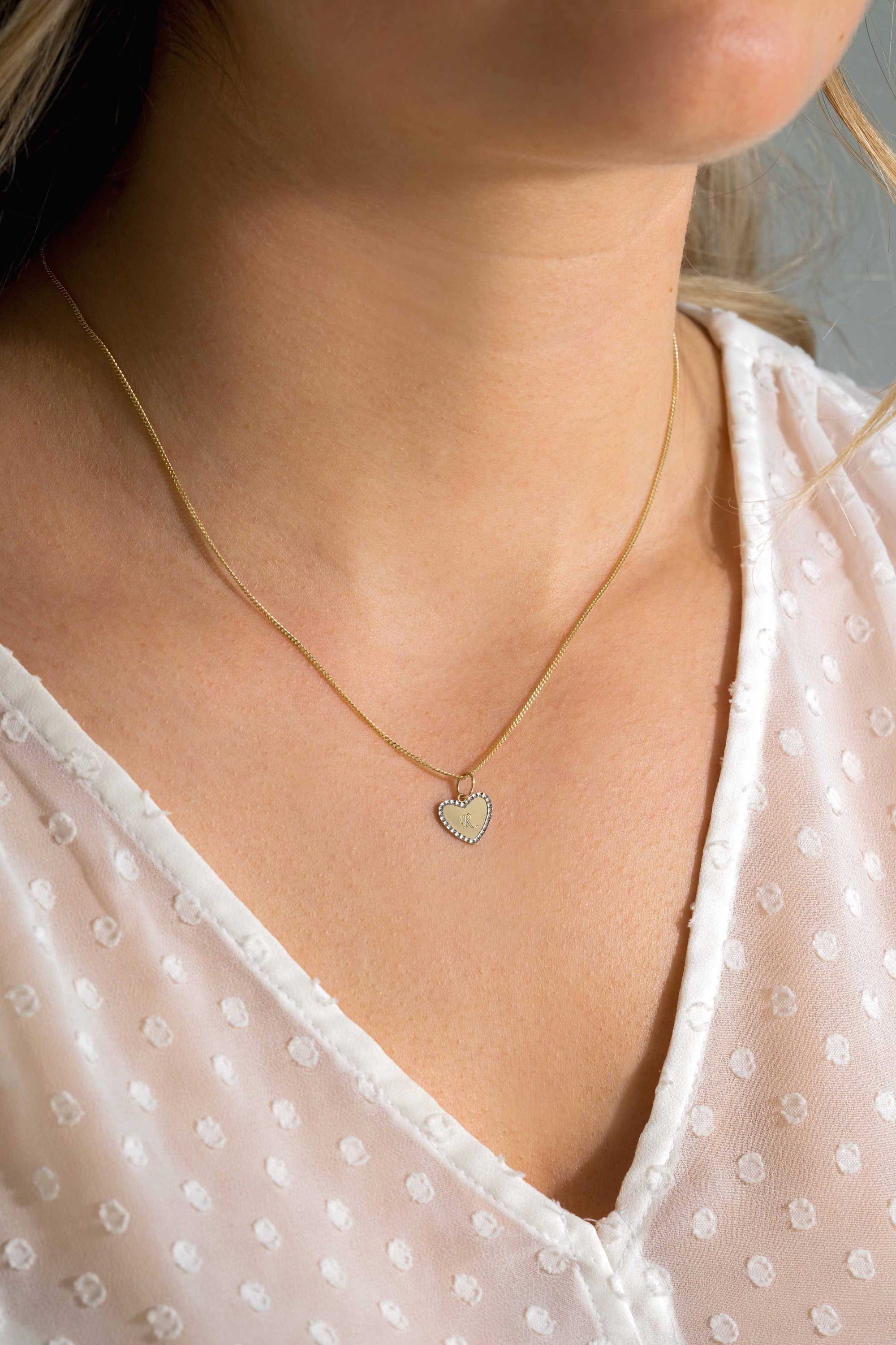 Zinzi Gold 14 krt gouden hanger met glanzend hartje van 10mm en met chique witgouden parelrand ZGH364-10 (zonder collier) - PansiteNederland.nl