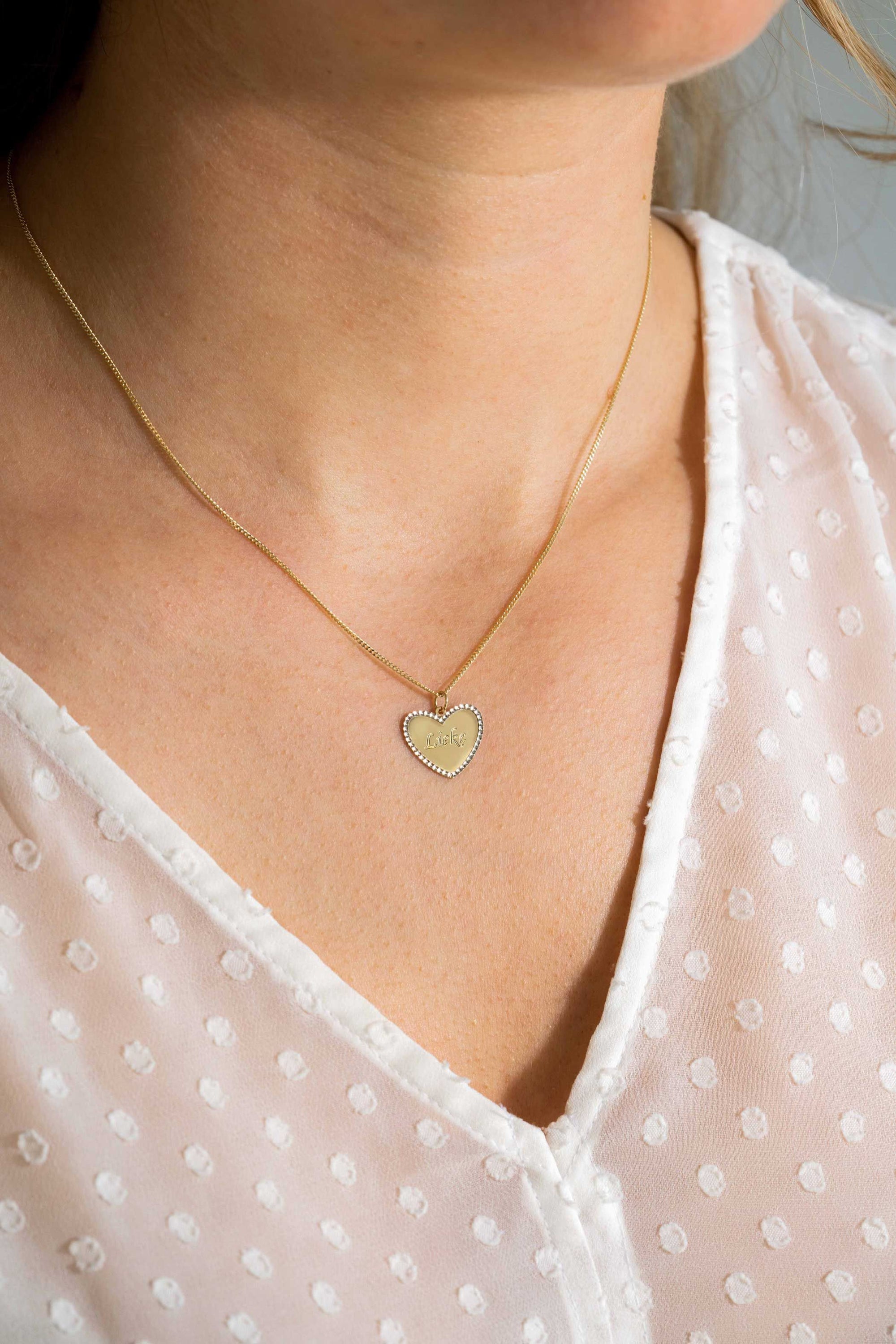 Zinzi Gold 14 krt gouden hanger met glanzend hartje van 15mm en met chique witgouden parelrand ZGH364-15 (zonder collier)