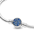 Snake chain sterling silver bracelet with disc clasp with stellar blue crystal 599288C01