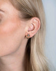 Zinzi zilveren oorstekers bicolor rond met kruisvorm en witte zirkonia's 13mm ZIO2249, exclusief en kwalitatief hoogwaardig. Ontdek nu!